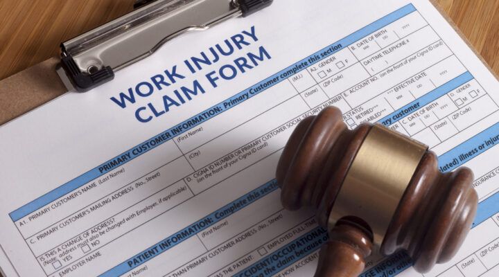 work injury claim form with a judge's gavel