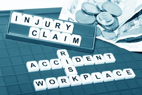 injury claim Scrabble pieces
