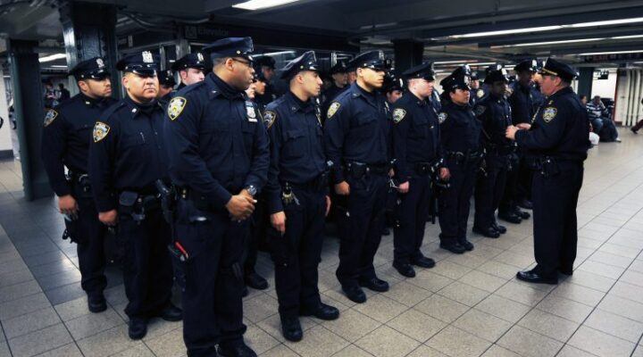 group of police officers in a subway station